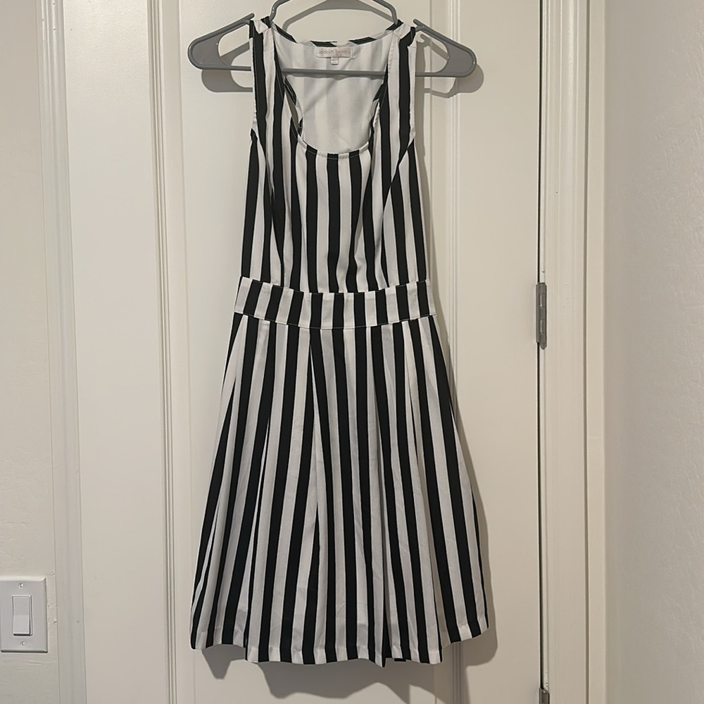 NWOT. Black and white vertical stripes dress with back cut out size Large